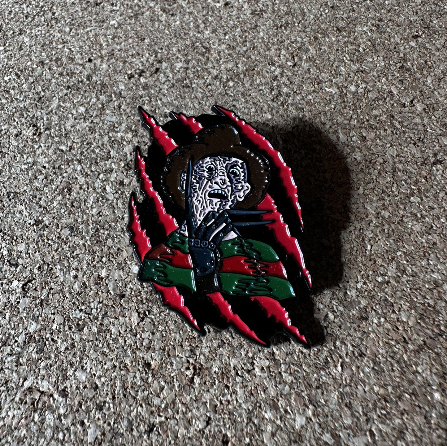 Slashing Freddy enamel pin